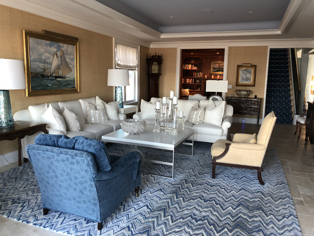 Living room. New rug, lamps, coffee table and beige side chair. 