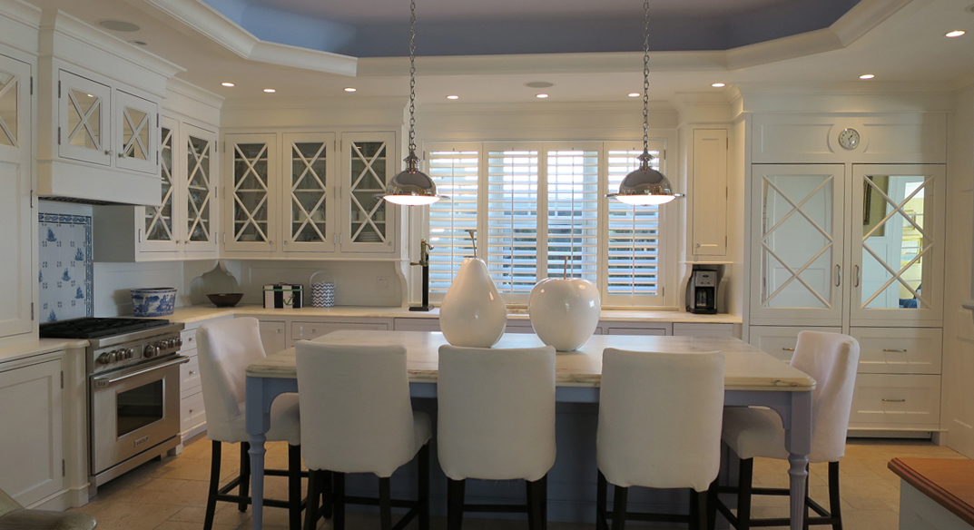 Space was rearranged for better storage and opened up to main living area. Mirrored doors conceal the refrigerator. 