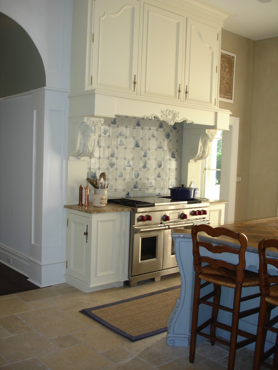 Range hood has cabinets above for infrequently used holiday items.  