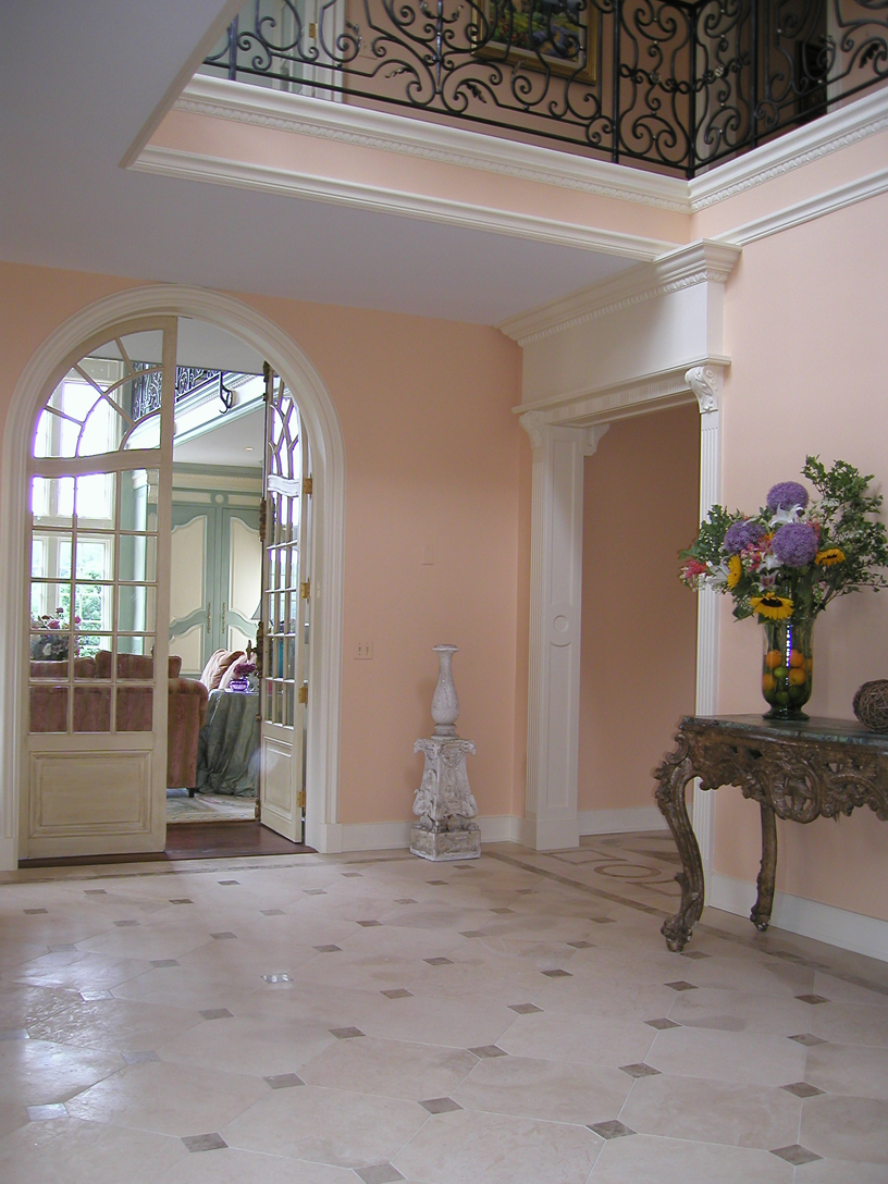 Front hall leads to library. 