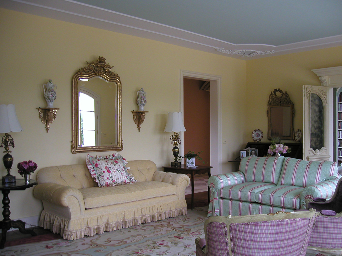 Living room connected to the two story library. 