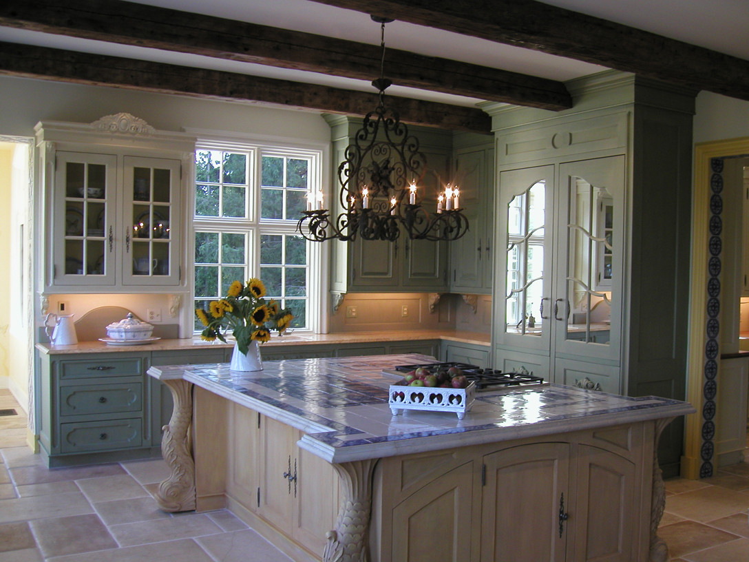 Kitchen with large island. Mirrored doors conceal refrigerator. All cabinets designed and fabricated by Beverly Ellsley Design. 