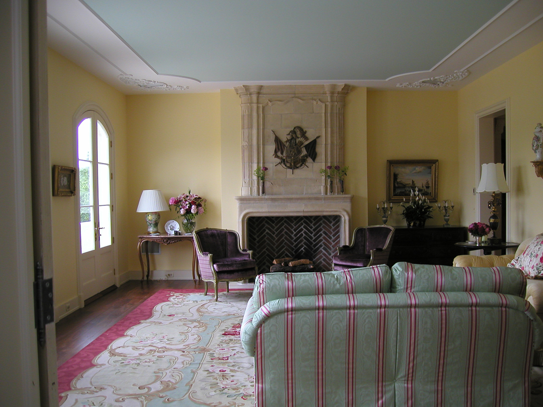 Living room has 3 French doors which lead to terrace. 