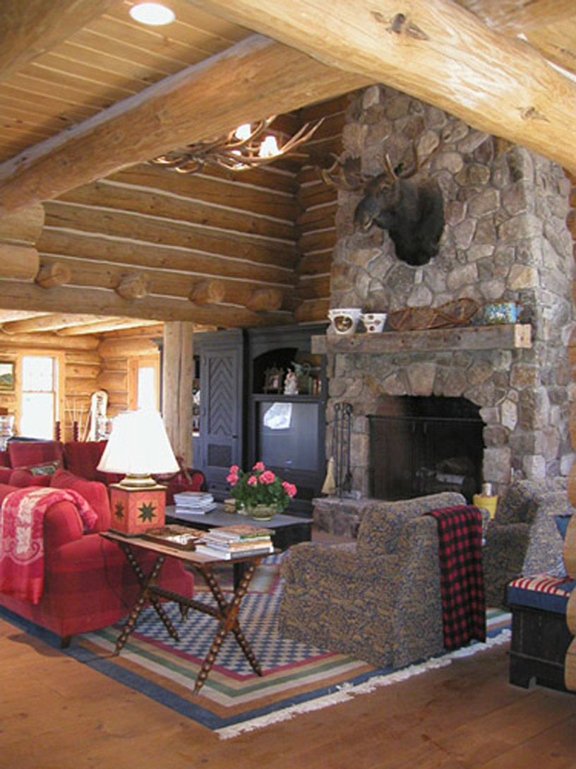 Living room with custom built-in television cabinet to left of fireplace. 