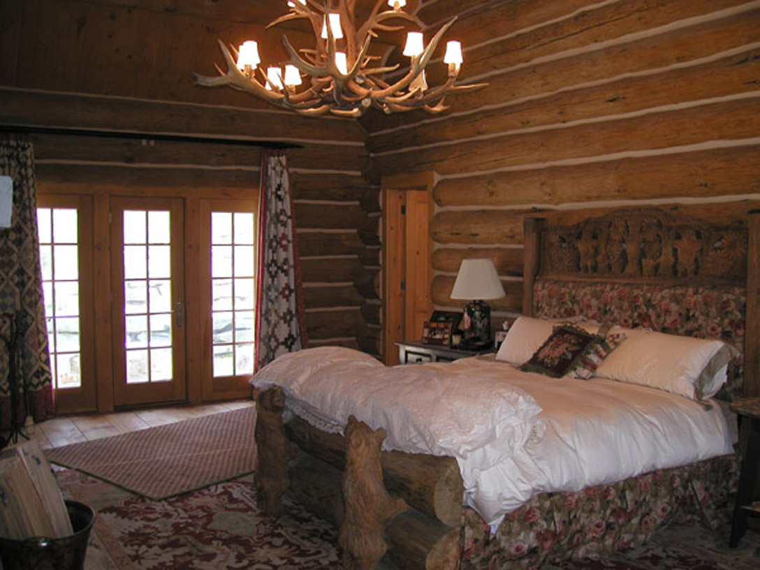 Antique quilts as curtains in master bedroom. 